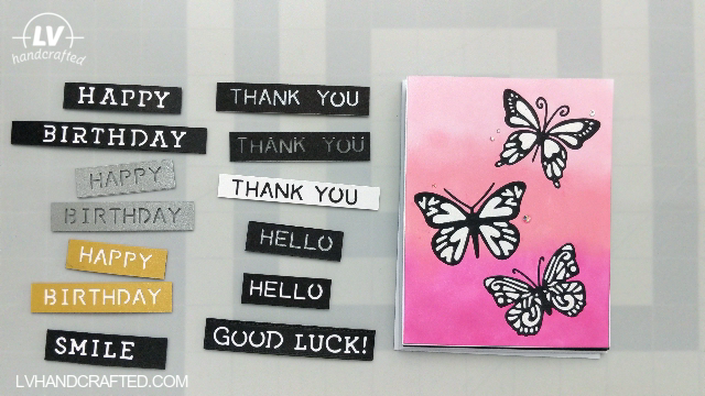 Photo of Handmade card with butterflies along with sentiment strips separately laid out to the side